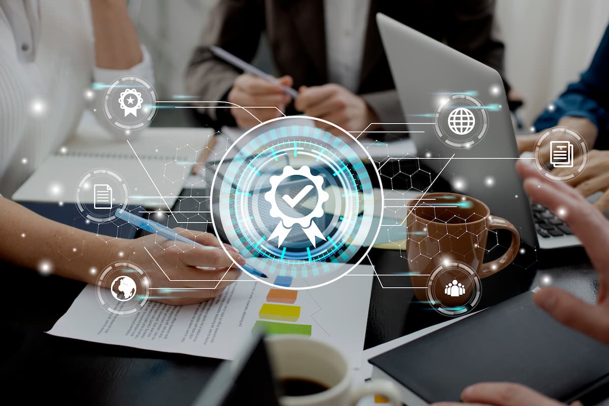 Team analyzing data with digital quality icons, illustrating the benefits of custom solutions instead of traditional SaaS.