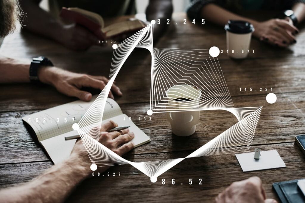 Team brainstorming with futuristic data overlay, symbolizing collaboration and strategy in legacy modernization initiatives.