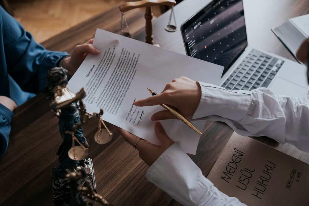 Two professionals reviewing a legal document, showing how Codence helps law firms eliminate manual processing.